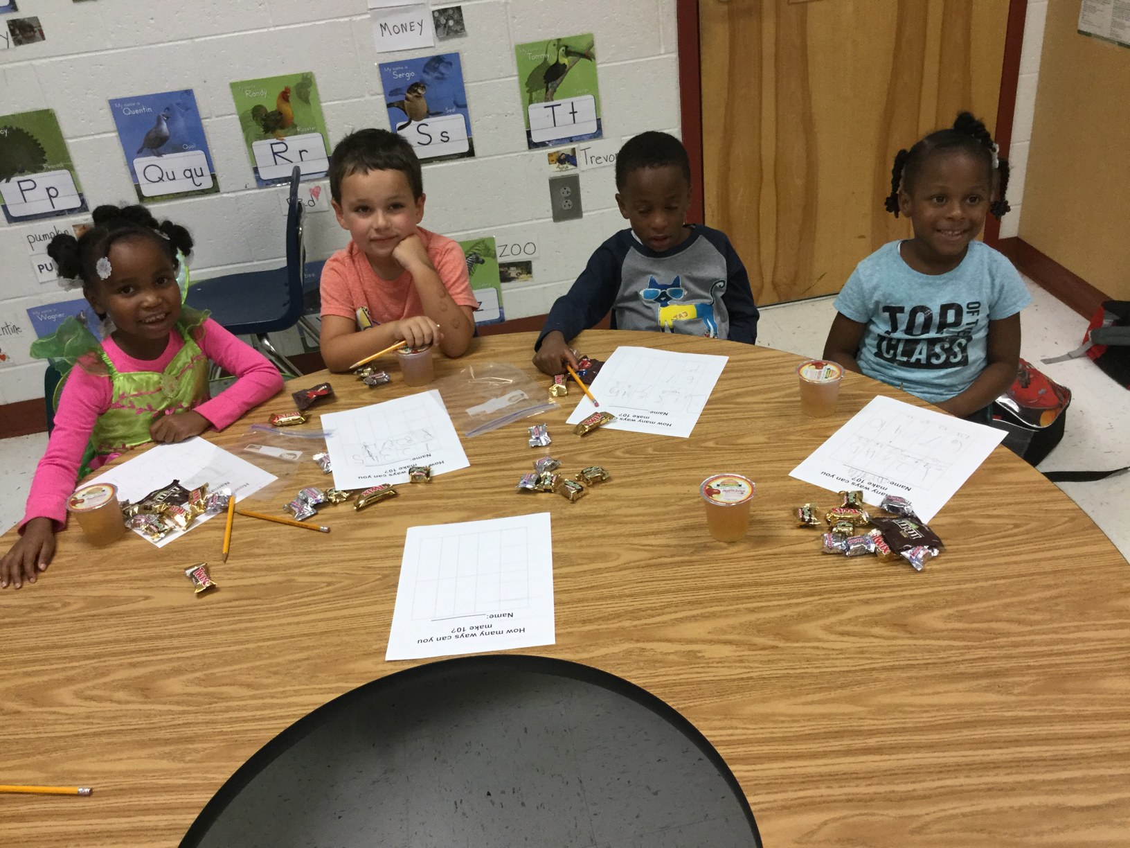 Kindergarten LEAP kids using candy to find different ways to make 10.