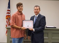 LHS baseball player with superintendent