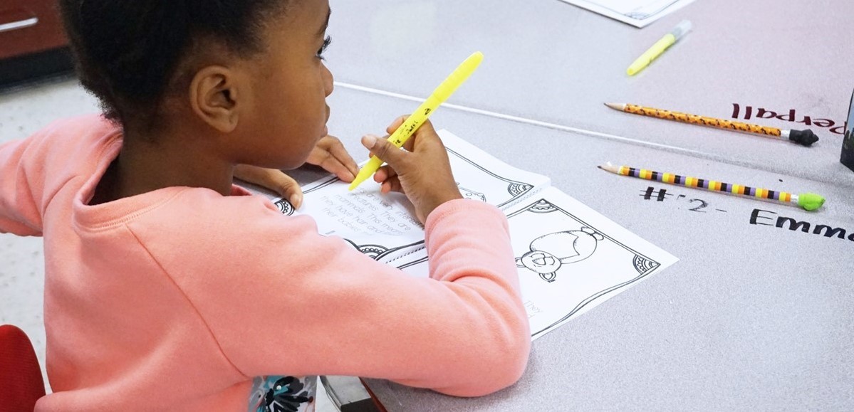 student working in class